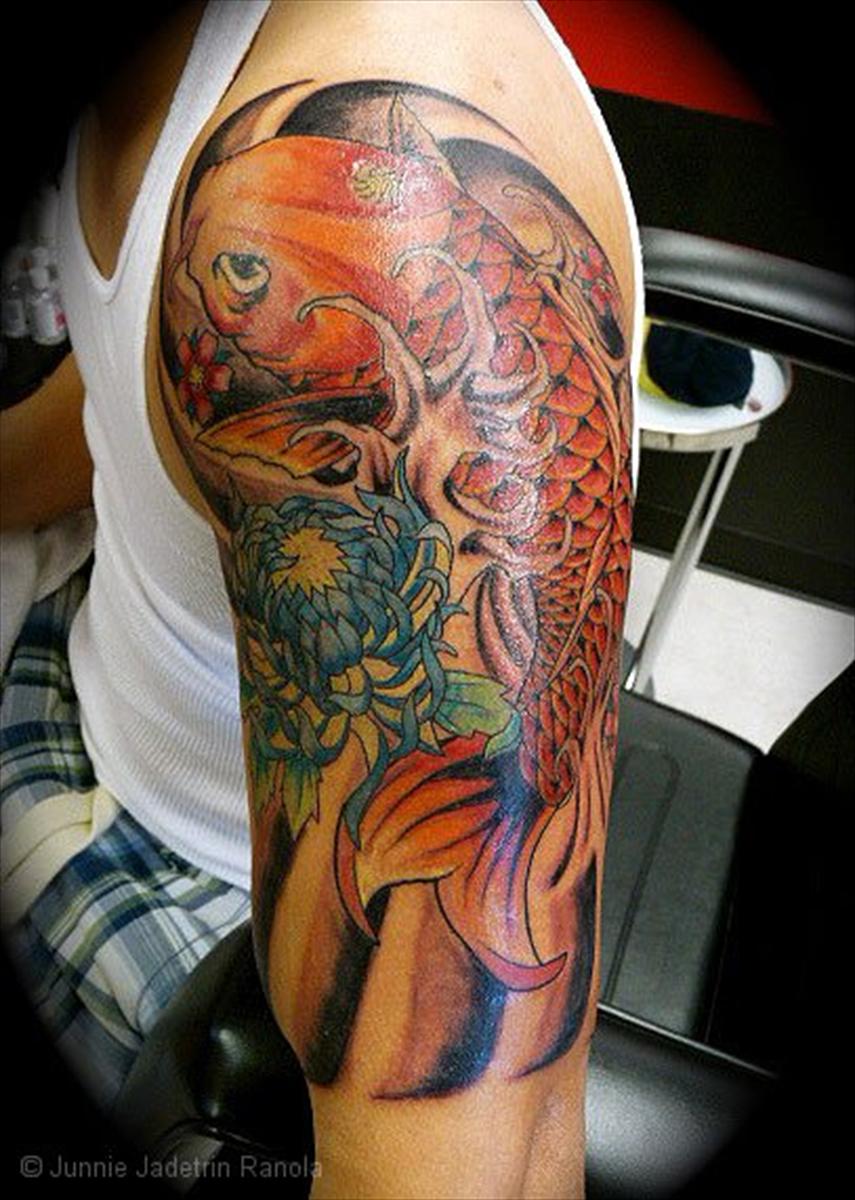 A Man S Leg With A Koi Fish Tattoo On It