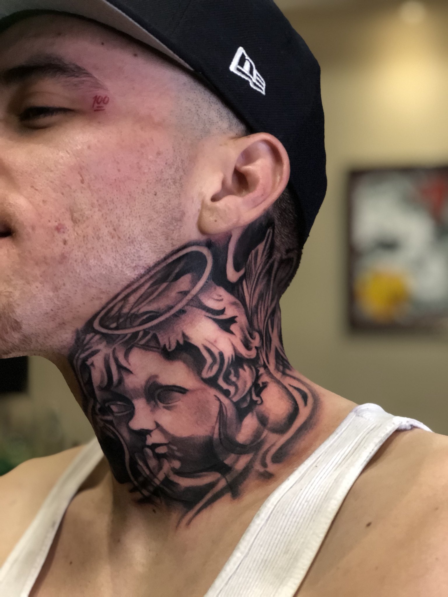 5 Ways to Interpret an Angel Whispering Ear Tattoo