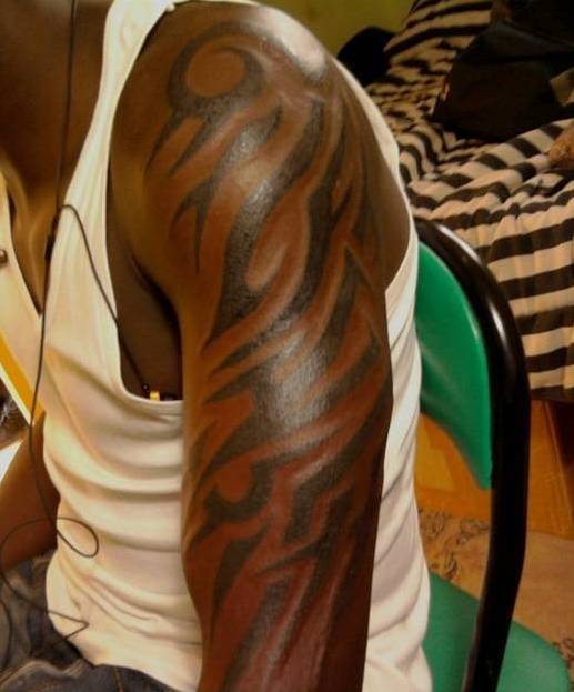 10 Striking Black Male Tattoo Designs and Meanings