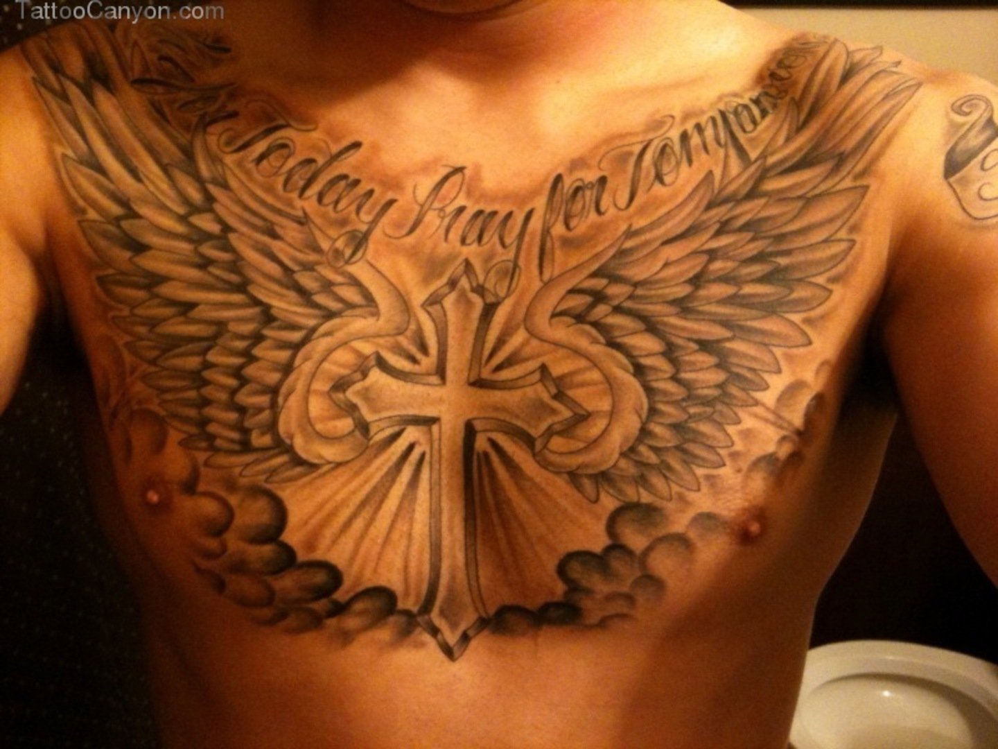 8 Striking Cross Tattoo Designs for Men’s Chests