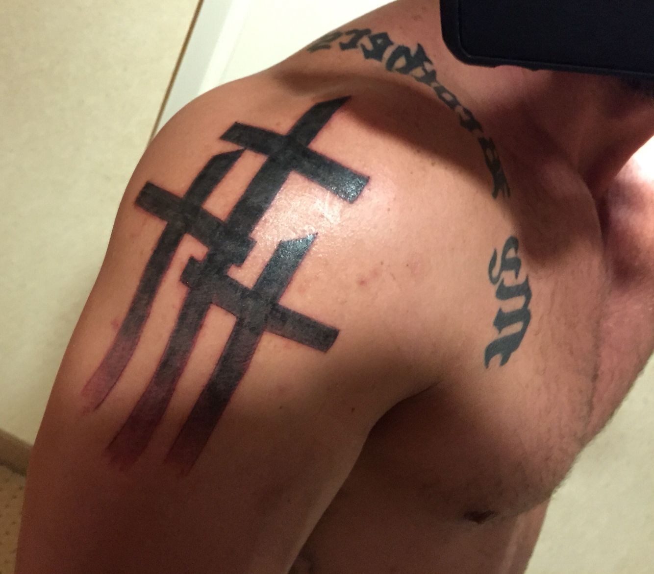 Cross Tattoos for Men: Shoulder Design Ideas