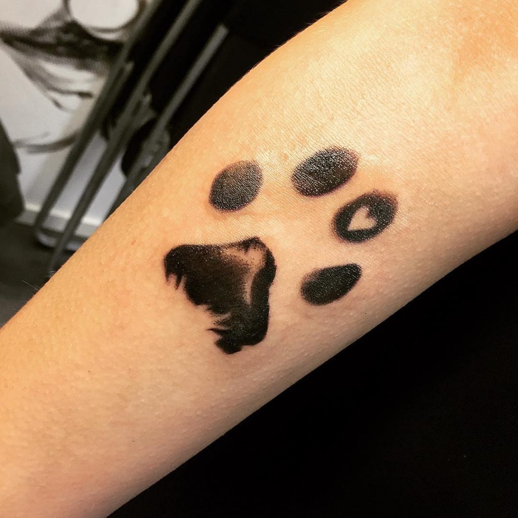 Dog In Paw Print Tattoo: Meaningful Ink Inspiration