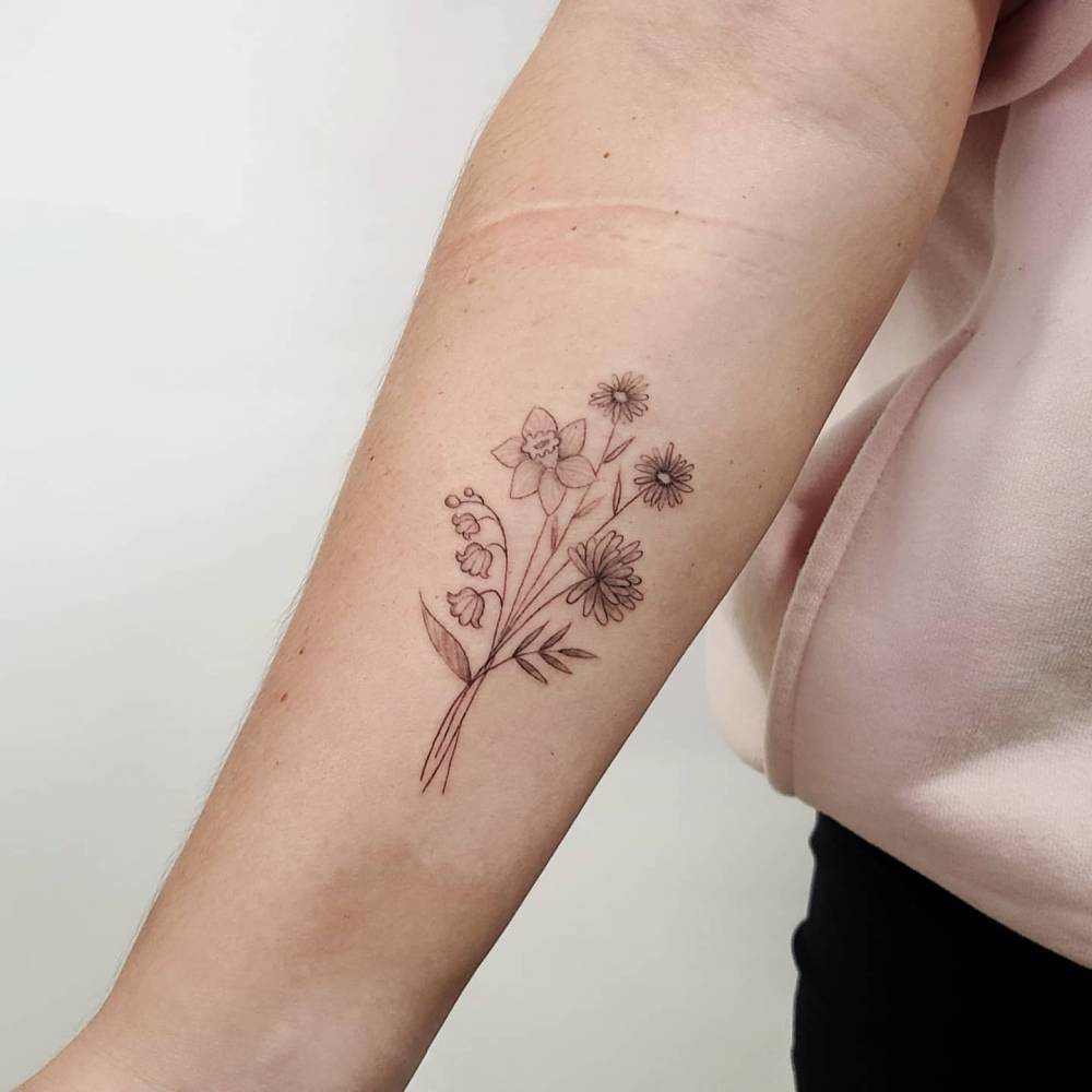 Fine Line Flower Bouquet Tattoo Located On The Upper