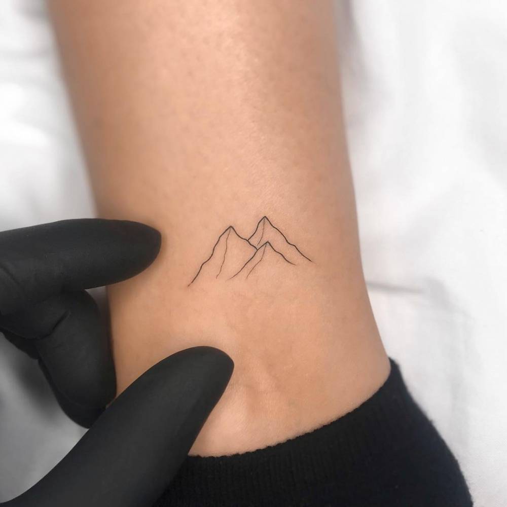 Discover the Intricate Beauty of Fine Line Mountain Tattoos