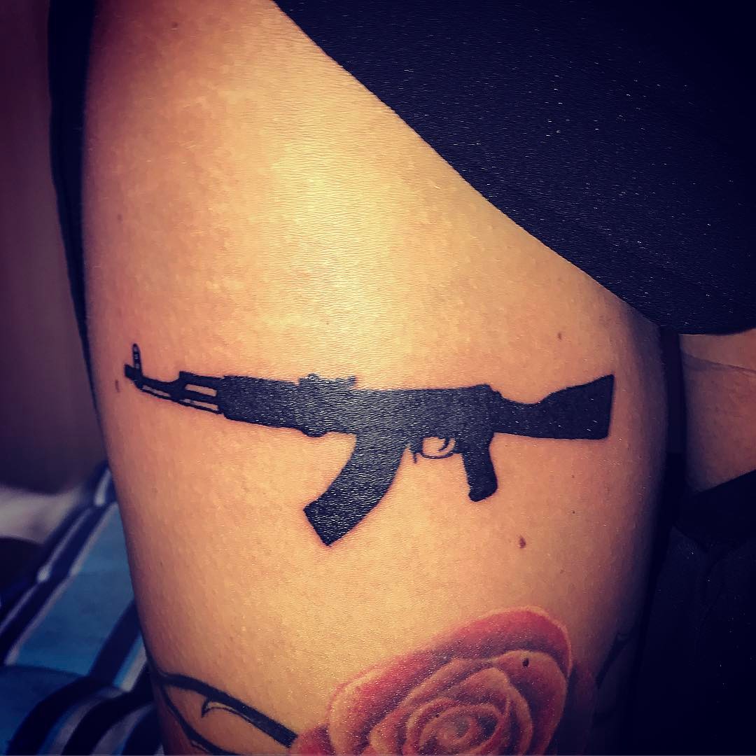 10 Stunning Gun Tattoo Ideas for Women