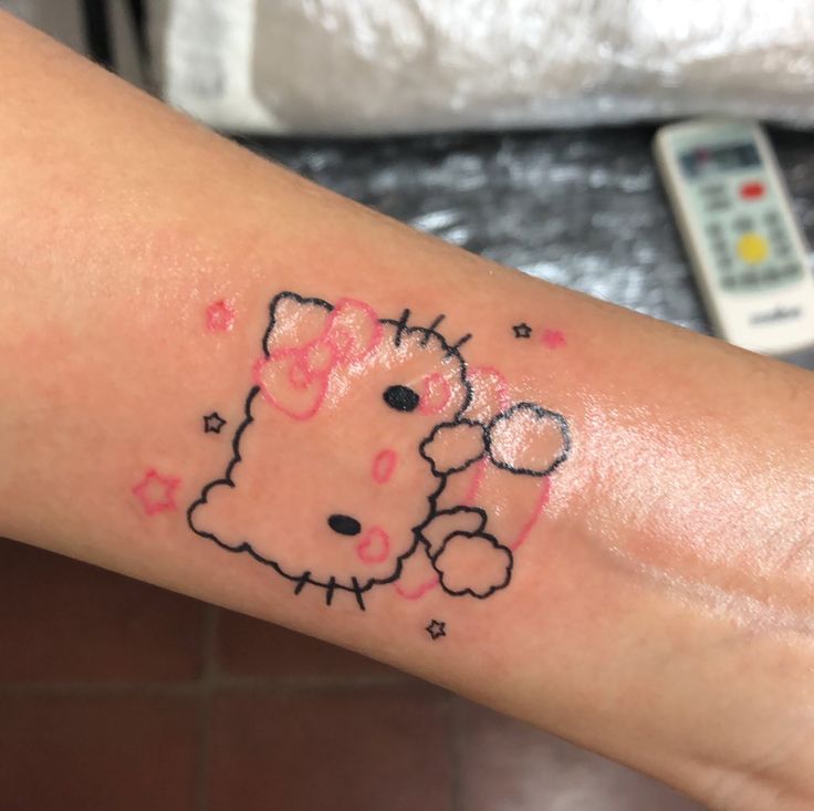 Minimalistic Style Hello Kitty Tattoo Located On The