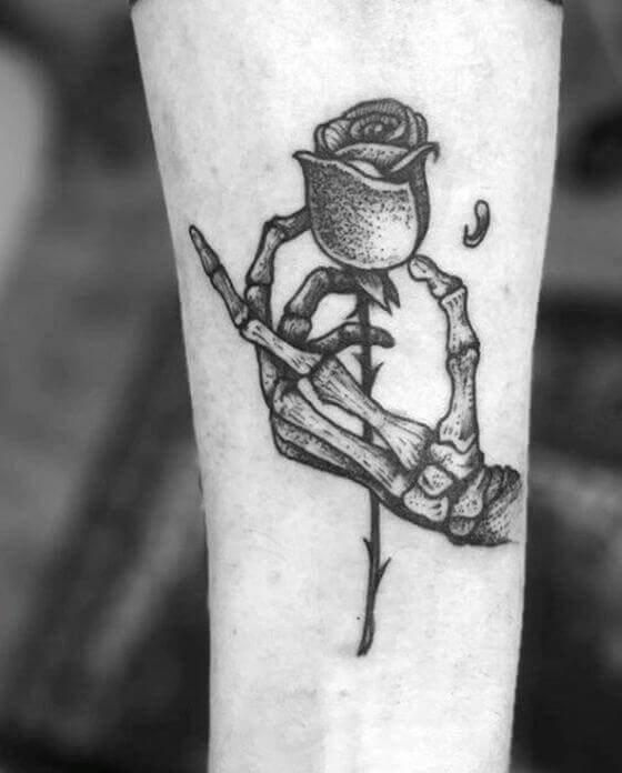 Skeleton Hand Holding Rose Tattoo: Meaning and Design Ideas