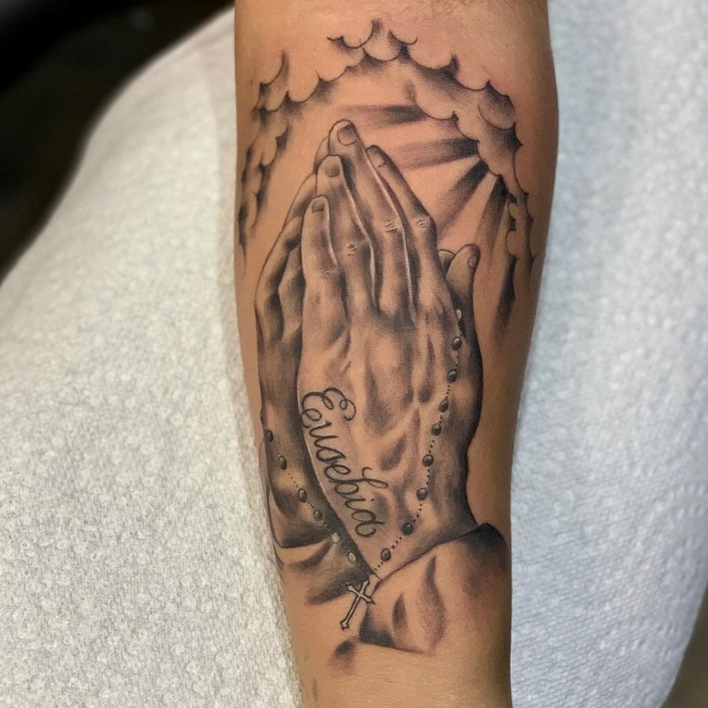 Tattoo Of Hands Praying