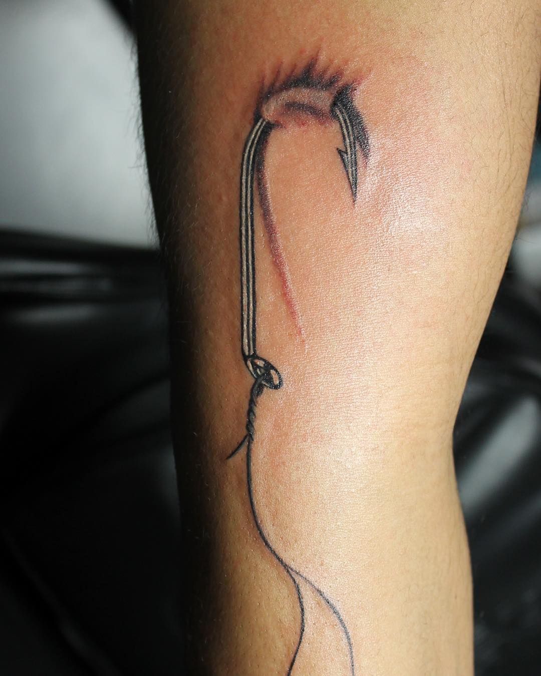 Fishing Hook Tattoos: Reel In the Meaning Behind the Ink