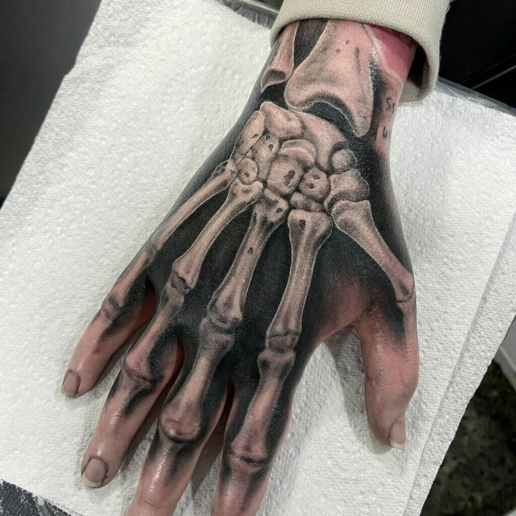 Top 73 Skeleton Hand Tattoo Ideas 2021 Inspiration Guide Skeleton Hand Tattoo Cool Tattoos